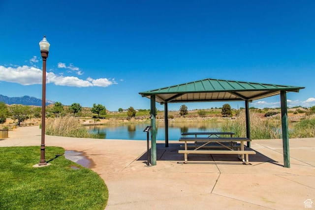 view of patio / terrace featuring a gazebo and a water and mountain view