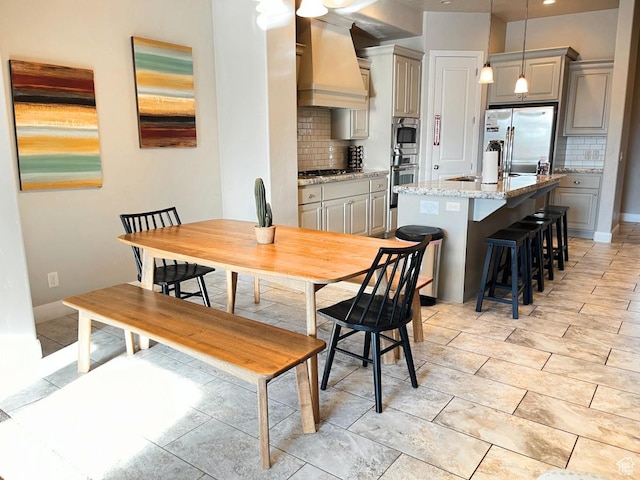 dining room featuring sink