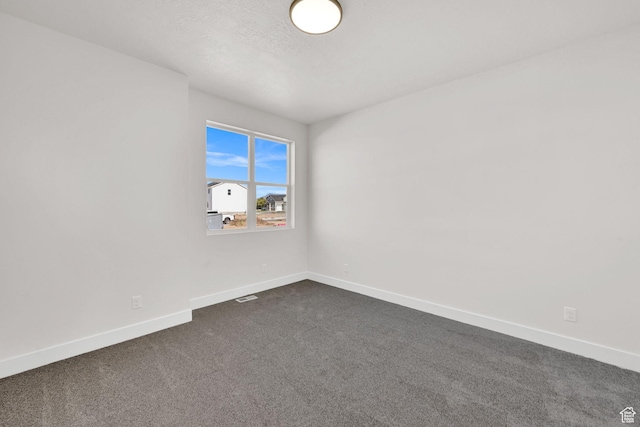 1928 W 1340 N, Clinton, UT 84015 - spare room featuring dark carpet and baseboards