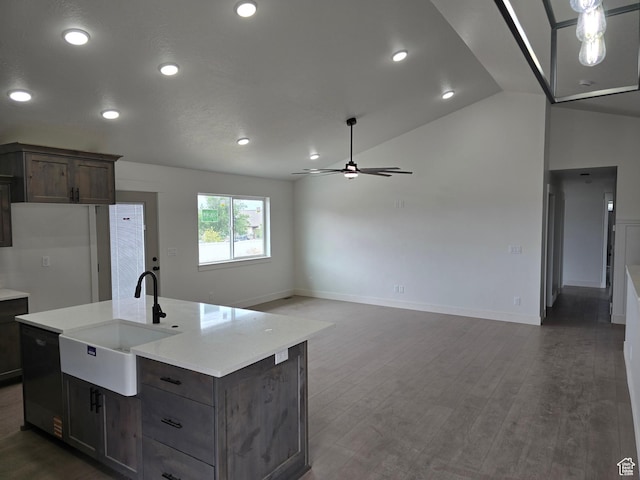 1928 W 1340 N, Clinton, UT 84015 - kitchen featuring a sink, ceiling fan, dishwasher, vaulted ceiling, and baseboards