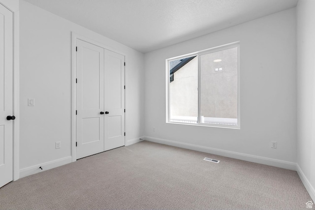 1137 W 2275 S, Syracuse, UT 84075 - unfurnished bedroom featuring light colored carpet and a closet
