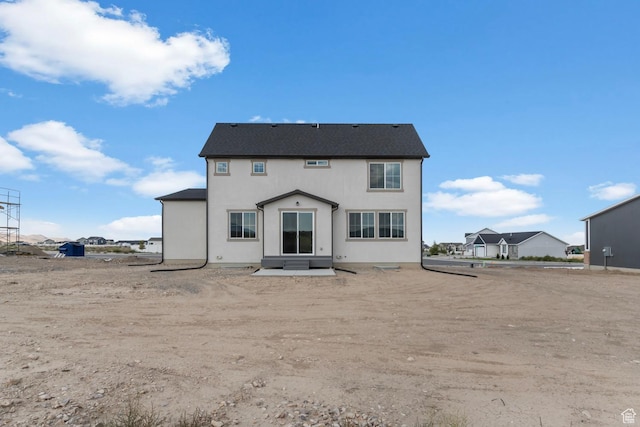 541 W Coyote Ridge Rd, Grantsville, UT 84029 - back of property featuring a patio area