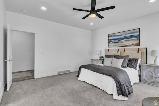 bedroom with light carpet and ceiling fan