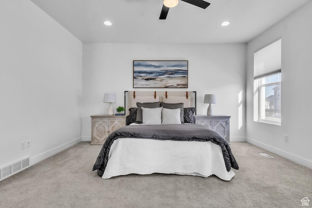 bedroom with light carpet and ceiling fan