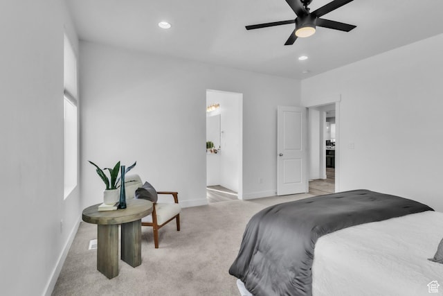 bedroom with light colored carpet and ceiling fan