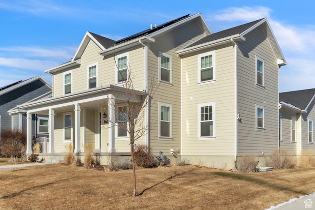 view of front of home with a front lawn and covered porch