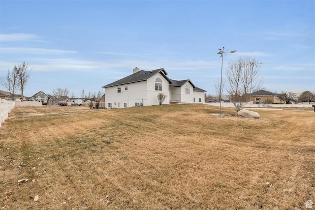 view of property exterior featuring a lawn