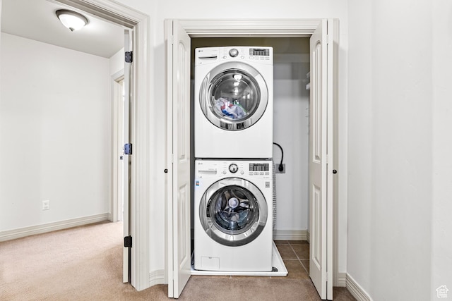9317 N Prairie Dunes Way, Eagle Mountain, UT 84005 - clothes washing area with dark colored carpet and stacked washing maching and dryer