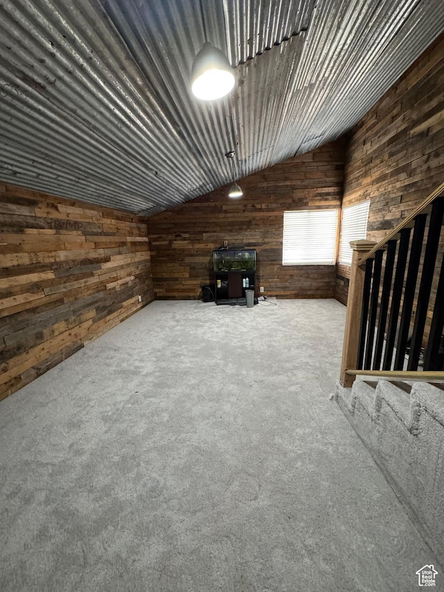 1050 S 500 W, Vernal, UT 84078 - carpeted living room featuring wood walls and lofted ceiling
