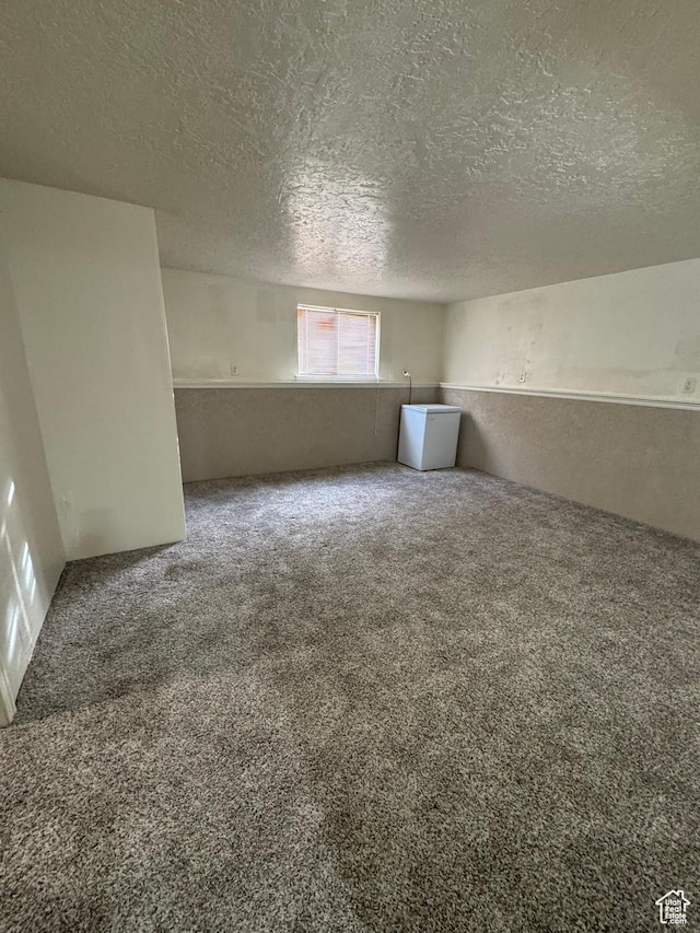 1050 S 500 W, Vernal, UT 84078 - spare room with a textured ceiling and carpet