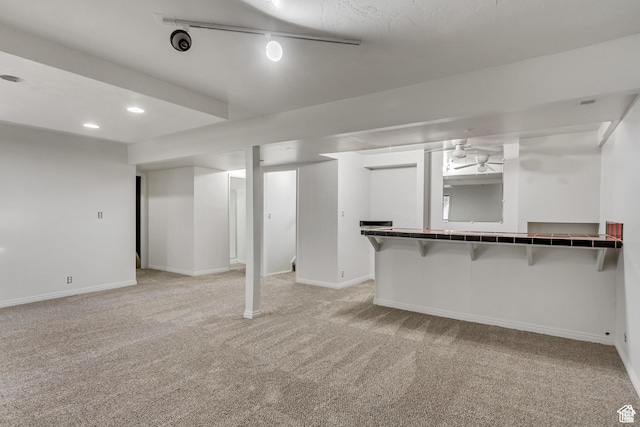 2573 Jordan Meadows Ln, West Jordan, UT 84084 - basement featuring track lighting and light colored carpet