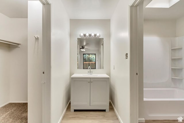 2573 Jordan Meadows Ln, West Jordan, UT 84084 - bathroom with vanity, hardwood / wood-style flooring, and ceiling fan