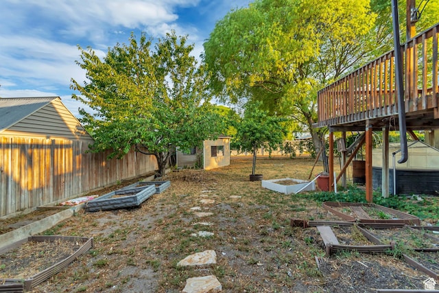 2573 Jordan Meadows Ln, West Jordan, UT 84084 - view of yard with a wooden deck and a storage unit