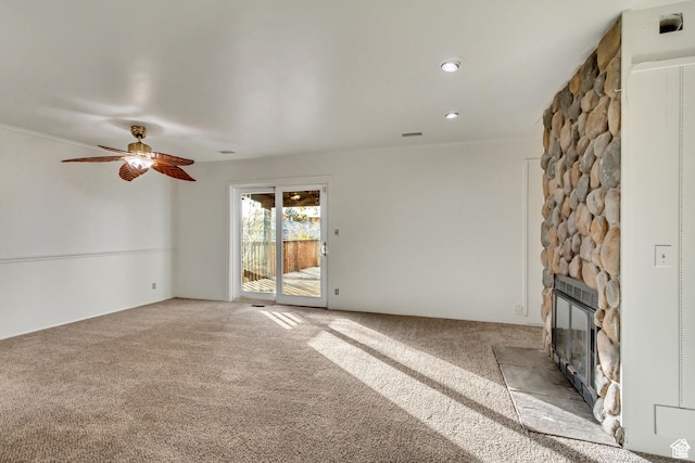 2573 Jordan Meadows Ln, West Jordan, UT 84084 - unfurnished living room featuring ceiling fan, light colored carpet, and a fireplace