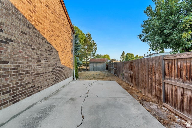 2573 Jordan Meadows Ln, West Jordan, UT 84084 - view of patio / terrace with a storage shed