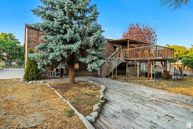 2573 Jordan Meadows Ln, West Jordan, UT 84084 - back of property featuring a wooden deck