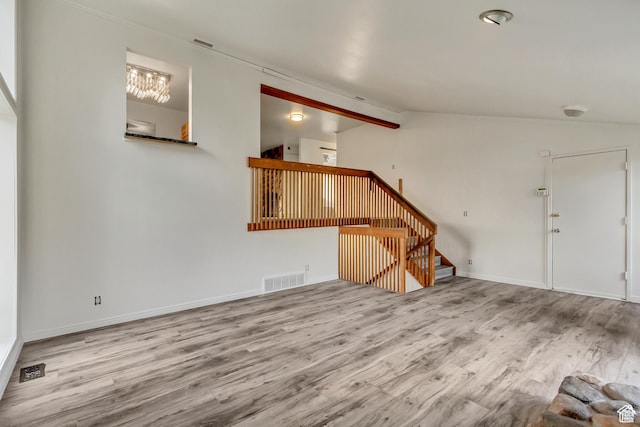 2573 Jordan Meadows Ln, West Jordan, UT 84084 - unfurnished living room with lofted ceiling with beams and hardwood / wood-style floors