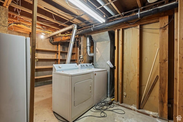 laundry room featuring separate washer and dryer