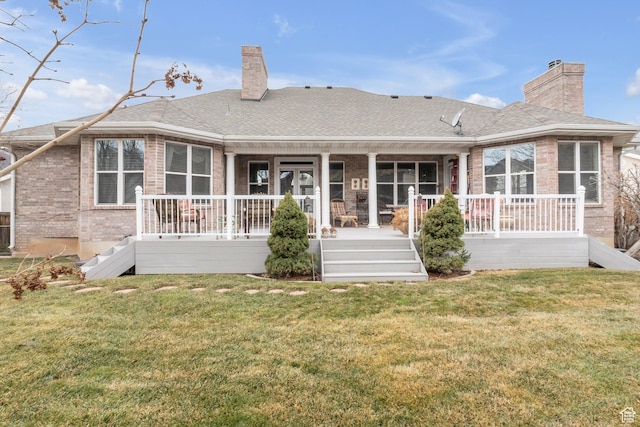 1839 E River Bottom Rd, Springville, UT 84663 - rear view of house featuring a chimney, brick siding, and a lawn