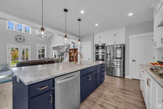 1932 W 200 N, Kaysville, UT 84037 - kitchen with appliances with stainless steel finishes, sink, a center island with sink, and white cabinets