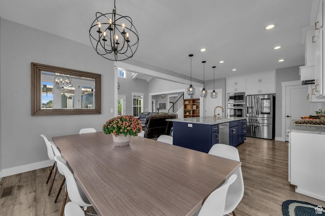 1932 W 200 N, Kaysville, UT 84037 - dining space featuring sink, light hardwood / wood-style flooring, and a chandelier