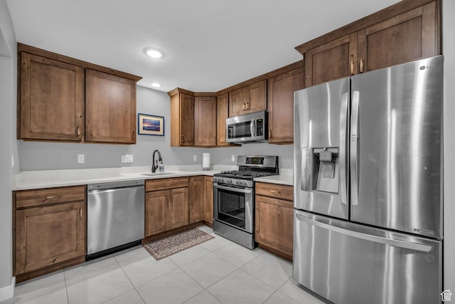 1932 W 200 N, Kaysville, UT 84037 - kitchen featuring appliances with stainless steel finishes, sink, and light tile patterned floors