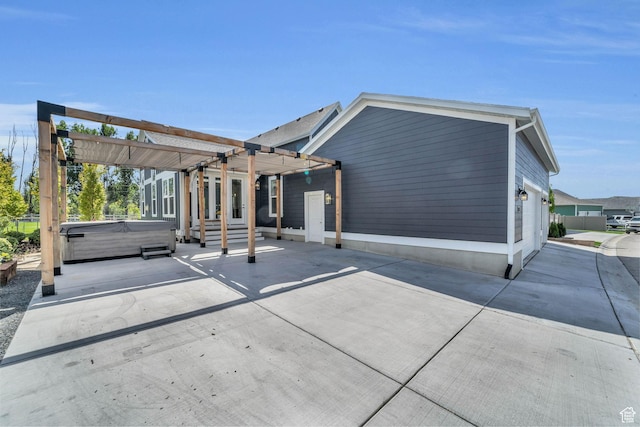 1932 W 200 N, Kaysville, UT 84037 - back of property featuring a hot tub, a garage, and a pergola