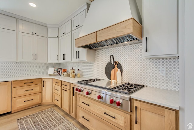 909 W 1180 N, Pleasant Grove, UT 84062 - kitchen featuring custom exhaust hood, stainless steel gas stovetop, light brown cabinets, light countertops, and tasteful backsplash