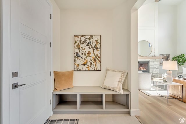 909 W 1180 N, Pleasant Grove, UT 84062 - mudroom featuring a warm lit fireplace and baseboards