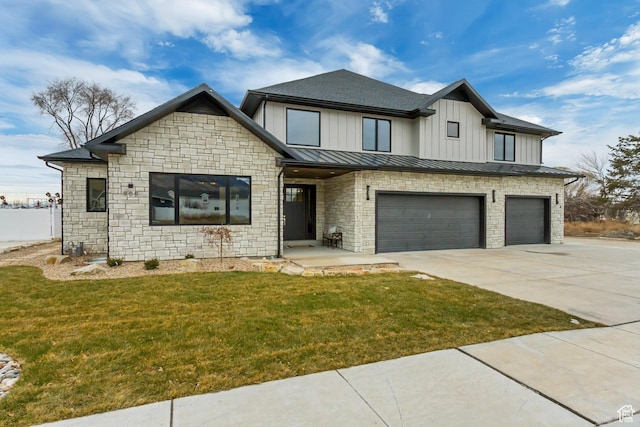 909 W 1180 N, Pleasant Grove, UT 84062 - view of front of home with a garage, concrete driveway, a front lawn, stone siding, and a standing seam roof