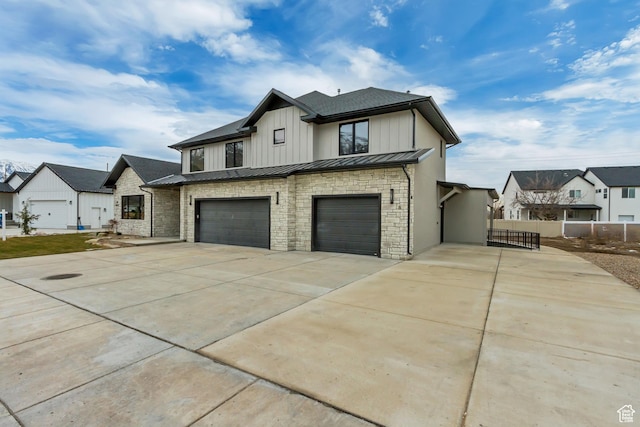 909 W 1180 N, Pleasant Grove, UT 84062 - view of front of house featuring an attached garage, fence, concrete driveway, a standing seam roof, and a residential view