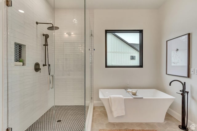 909 W 1180 N, Pleasant Grove, UT 84062 - full bathroom featuring a stall shower, a freestanding tub, tile patterned floors, and baseboards