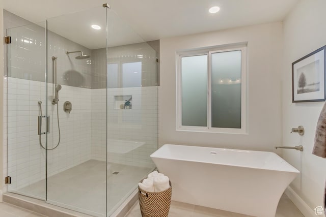 909 W 1180 N, Pleasant Grove, UT 84062 - bathroom featuring a stall shower, a freestanding bath, baseboards, recessed lighting, and tile patterned floors