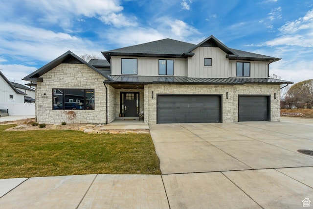 909 W 1180 N, Pleasant Grove, UT 84062 - view of front of home featuring an attached garage, concrete driveway, a standing seam roof, and a front lawn