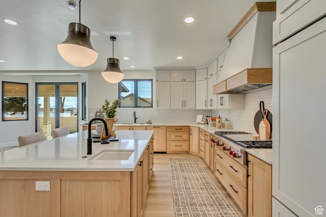 909 W 1180 N, Pleasant Grove, UT 84062 - kitchen with a sink, custom exhaust hood, stainless steel gas stovetop, fridge, and recessed lighting