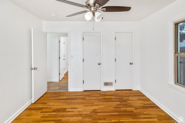 unfurnished bedroom featuring light hardwood / wood-style flooring and ceiling fan