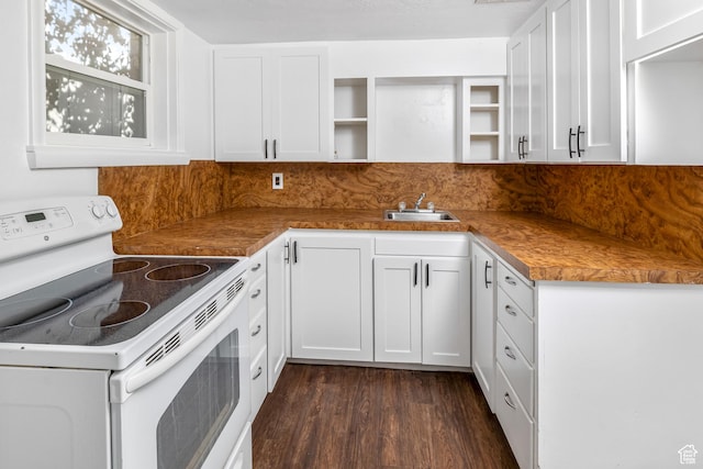 kitchen with white cabinetry, sink, white electric range, and dark wood-type flooring