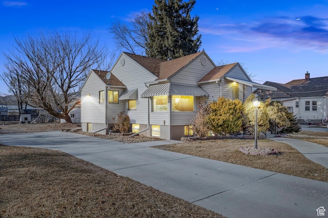 bungalow-style house featuring a yard