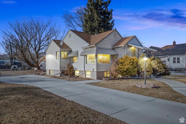 bungalow-style house featuring a lawn
