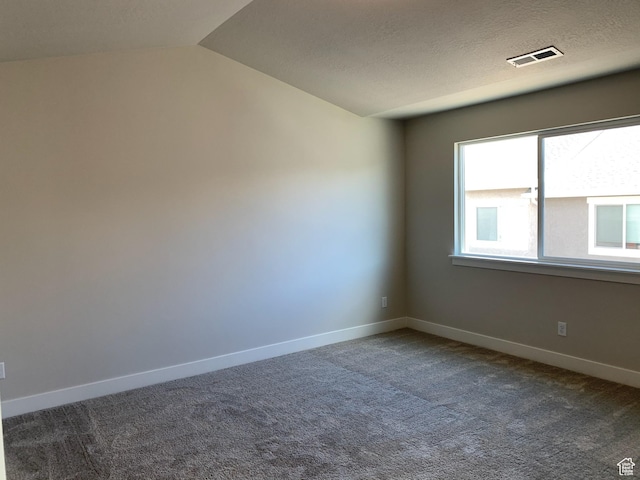 1538 N 3890th St W, Lehi, UT 84043 - carpeted spare room featuring baseboards, a textured ceiling, visible vents, and vaulted ceiling