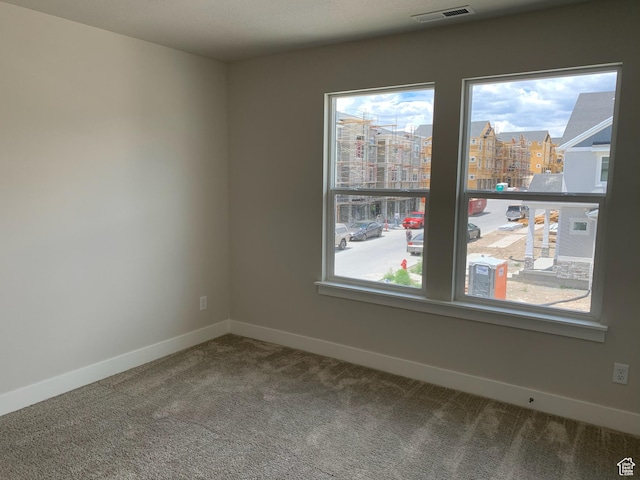 1538 N 3890th St W, Lehi, UT 84043 - carpeted empty room featuring baseboards, visible vents, and a view of city