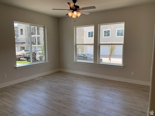 1538 N 3890th St W, Lehi, UT 84043 - unfurnished room with baseboards, visible vents, a ceiling fan, and wood finished floors