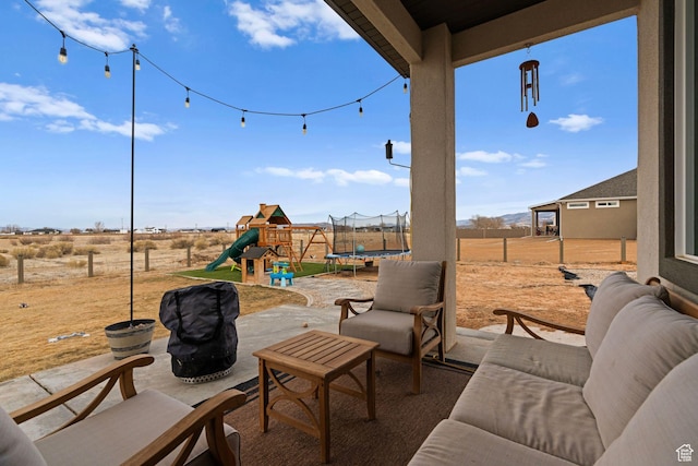 2418 W 4975 N, Cedar City, UT 84721 - view of patio / terrace featuring a playground, a trampoline, and a rural view