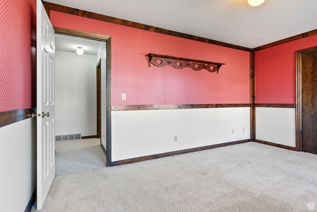 empty room featuring light colored carpet