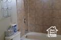 bathroom with separate shower and tub