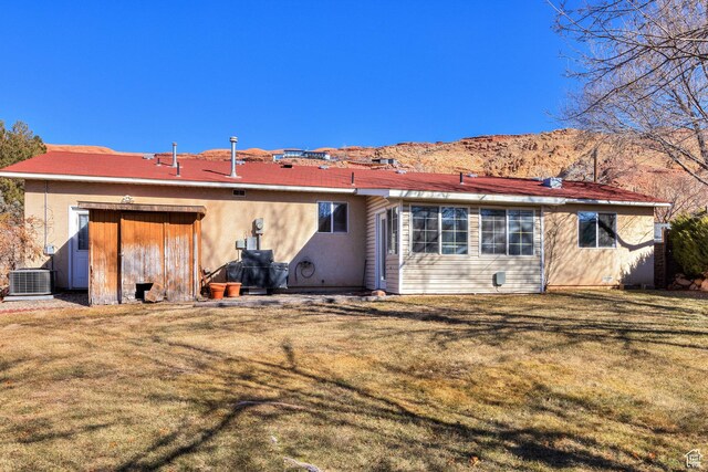 357 W Hobbs St, Moab, UT 84532 - back of house featuring cooling unit and a yard