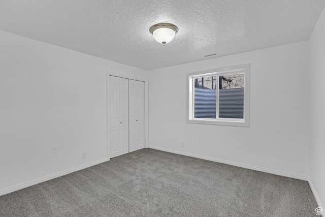 645 N 800 W, Brigham City, UT 84302 - unfurnished bedroom with carpet floors, a closet, and a textured ceiling