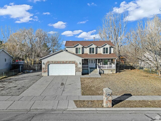 645 N 800 W, Brigham City, UT 84302 - view of front of home featuring a garage and covered porch