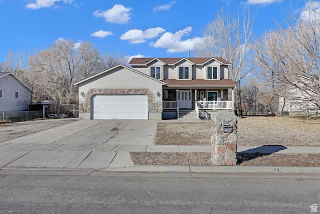 645 N 800 W, Brigham City, UT 84302 - view of front of house featuring a garage and covered porch