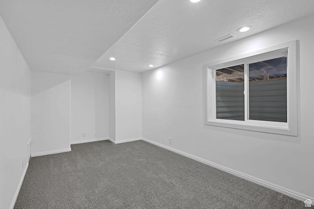 645 N 800 W, Brigham City, UT 84302 - spare room with dark colored carpet and a textured ceiling